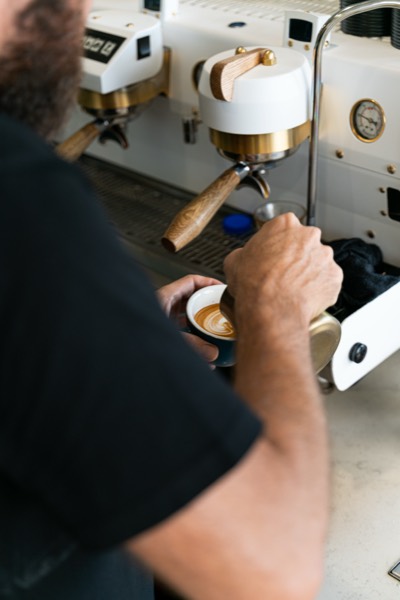 Espresso pouring from the coffee machine