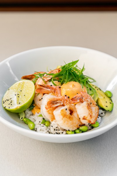 A fresh prawn and avocado bowl with lime